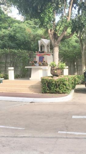 a monument in a park next to a tree at Studio Seaview Jomtien floor12 23sqm in Jomtien Beach
