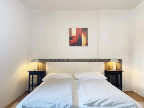 two beds sitting next to each other in a bedroom at Guest House Šempeter in Šempeter v Savinjski Dolini