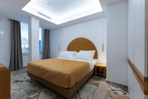 Postel nebo postele na pokoji v ubytování Maggiano Boutique Hotel