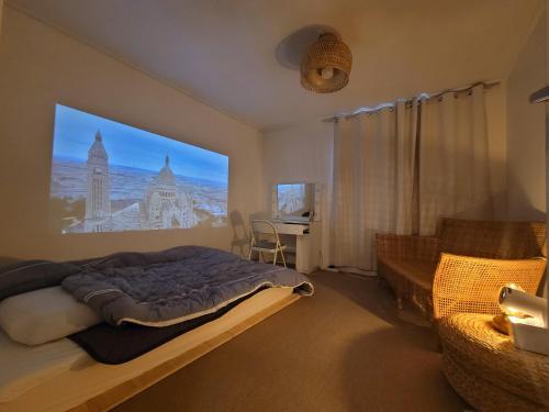 a bedroom with a bed and a desk in it at Moomoo House in Busan