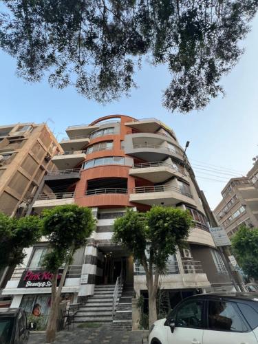 a tall building with stairs in front of it at Panorama studio in the heart of heliopolis, cairo in Cairo