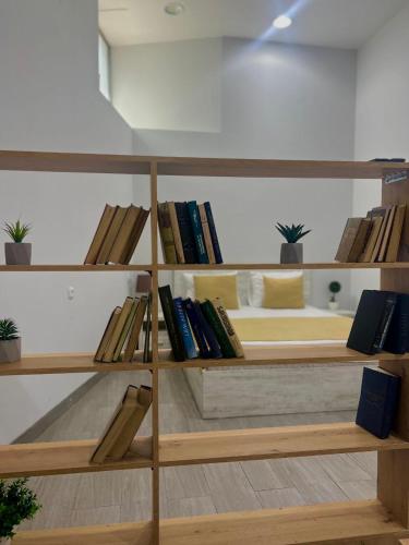 a book shelf with books on top of it at Hotel Menua in Yerevan