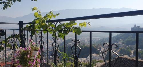 a fence with a view of a city at Panoramic Vlachos in Gjirokastër