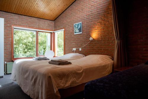 Postel nebo postele na pokoji v ubytování Theijwerck - Ouddorp NOT INTENDED FOR COMPANY OR WORK-RELATED STAYS