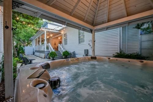 a hot tub in the backyard of a house at Bama Bed and Breakfast - Wisteria Suite in Tuscaloosa