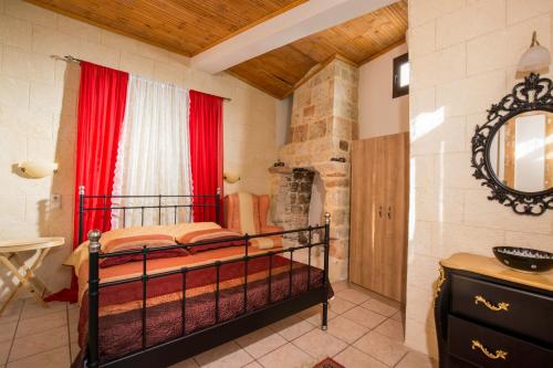 a bedroom with a bunk bed and a bathroom at Evdokia Hotel in Rhodes Town