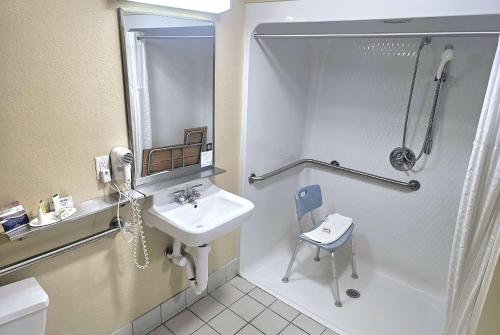 a bathroom with a sink and a shower at Baymont by Wyndham Rolla in Rolla