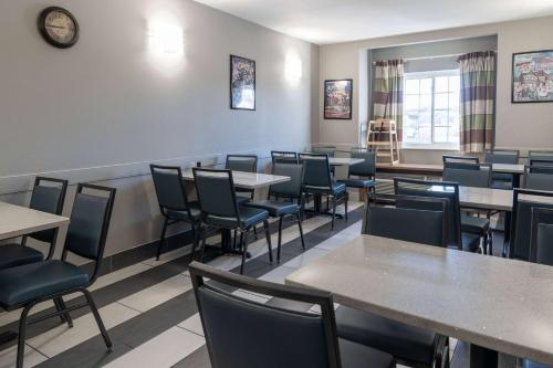a dining room filled with tables and chairs at Microtel Inn & Suites by Wyndham Pigeon Forge in Pigeon Forge