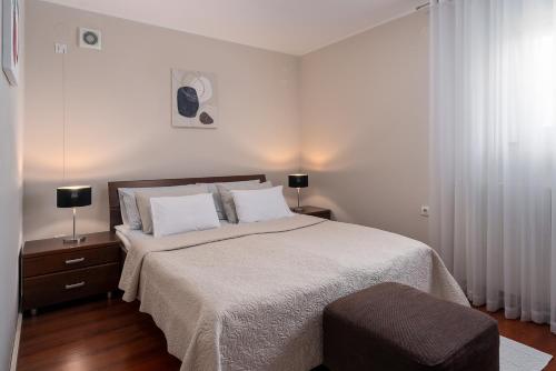 Postel nebo postele na pokoji v ubytování Apartman Neli