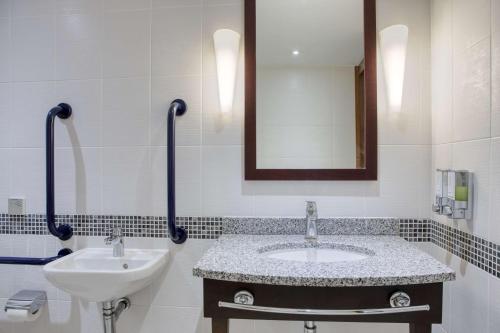 a bathroom with a sink and a mirror at Hampton by Hilton York in York