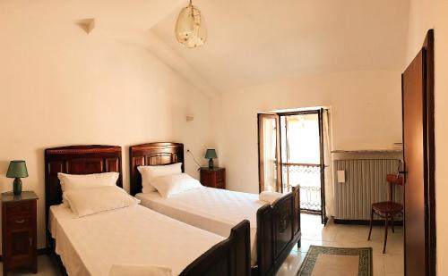 Postel nebo postele na pokoji v ubytování Casa dell'Angelo custode