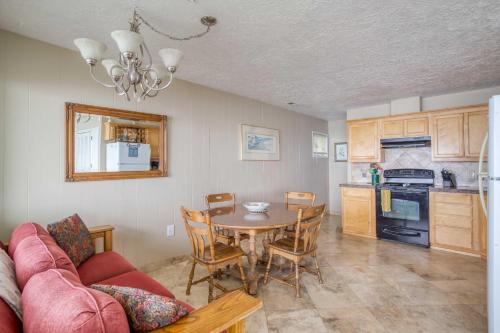 a kitchen and dining room with a table and chairs at Casa de Navarro in Lincoln City