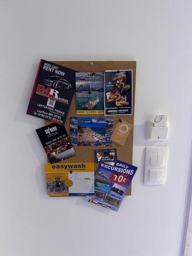 a box filled with brochures on top of a table at Premium Studio DANAI 14 Paralia Beach in Paralia Katerinis