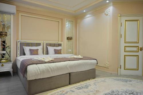 a bedroom with a large bed in a room at Hotel Samaria Terrace in Samarkand