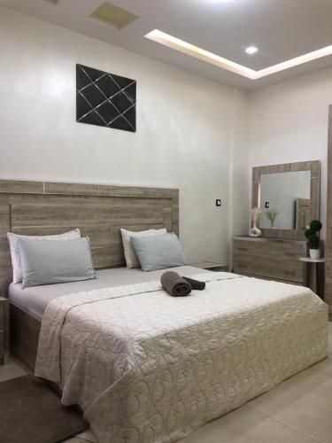 Ένα ή περισσότερα κρεβάτια σε δωμάτιο στο APPARTEMENT MEUBLE DAKAR Suite 2