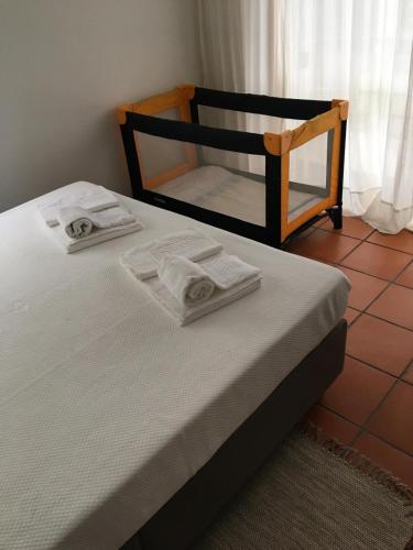 Katil atau katil-katil dalam bilik di Árvore Cozy com Jardim