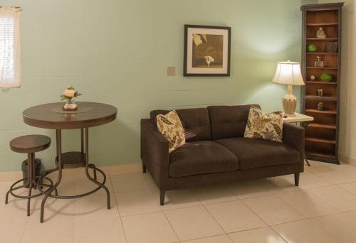a living room with a couch and a table at Ocean Villa Guam in Tamuning