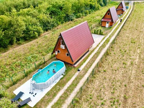 an aerial view of a house and a swimming pool at Pyramid Energy House in Visoko