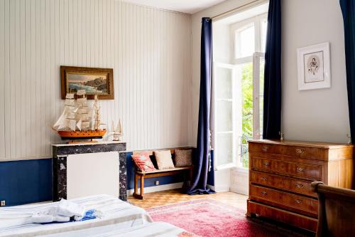 a bedroom with two beds and a dresser and a window at Séminaire,famille,amis,15 couchages, proche plages in Saint-Gervais