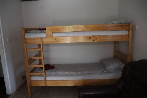 a couple of bunk beds in a room at Cabană în inima munților - Gálkuti Kulcsosház in Bălan