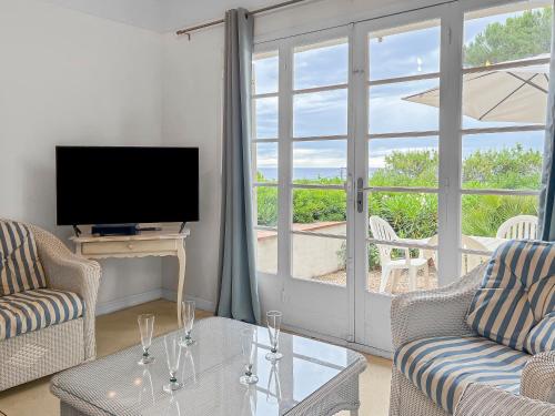 Et tv og/eller underholdning på Oasis Familiale près des Plages