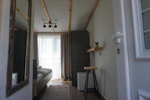 a living room with a couch and a window at Hill Homes Montenegro in Petrovac na Moru
