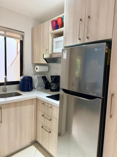 Η κουζίνα ή μικρή κουζίνα στο Casa Limonada Ground Condo