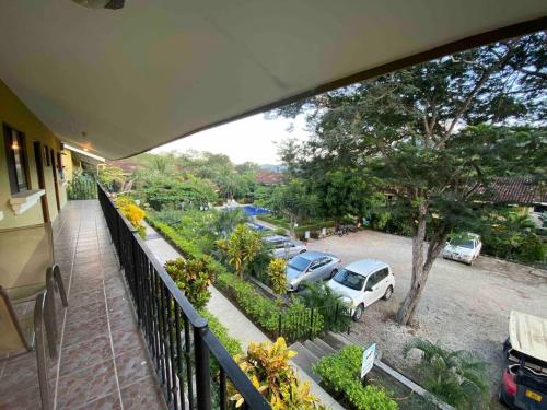 a balcony with a view of a parking lot at Cabaa En El Sol Cabin In The Sun in Ocotal
