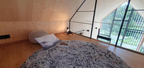 Ein Bett oder Betten in einem Zimmer der Unterkunft 1Step2AllStars Baumhaus