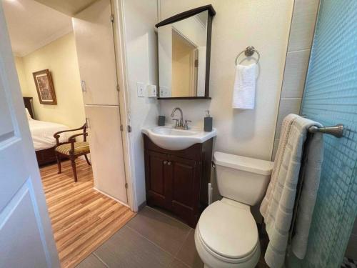 a small bathroom with a toilet and a sink at Pacific Beach Getaway Blocks From The Beach in San Diego