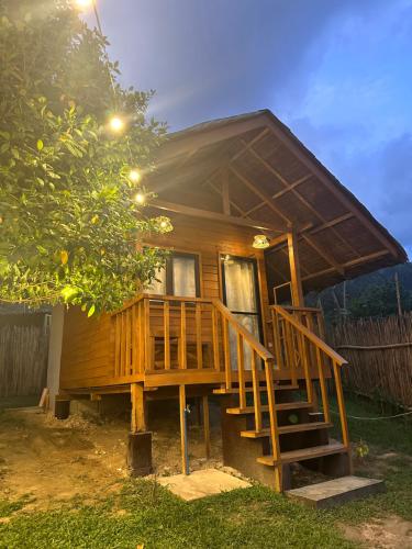 a wooden house with a staircase leading to it at Barton Hills in San Vicente