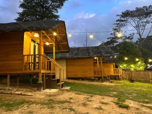 a wooden house with a porch and a deck at Barton Hills in San Vicente