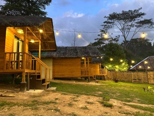 a house with a porch and a deck at night at Barton Hills in San Vicente