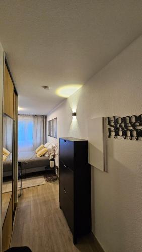 Ένα ή περισσότερα κρεβάτια σε δωμάτιο στο Logement Arche de la Défense, Arena spectacle, wifi, parking gratuit