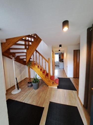 a living room with a staircase and a living room at Private house 2km from old town in Riga