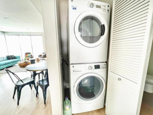 a laundry room with a washer and dryer at 3 Bedroom Penthouse in Downtown! in San Diego