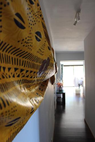 a room with a wall with a tiger painting on it at MER & SOLEIL in Morsiglia