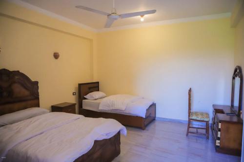 Katil atau katil-katil dalam bilik di Quiet Gate Guest House