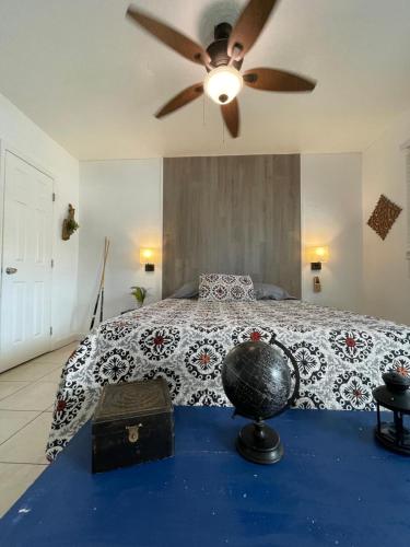 a bedroom with a bed with a ceiling fan at Cozy Studio near Coconut Grove in Miami