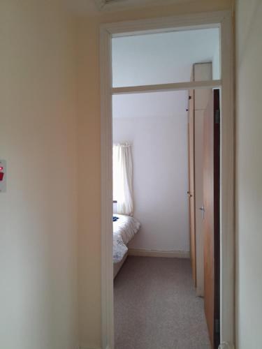 a room with a door leading to a bedroom at Mary's house in OʼBriensbridge