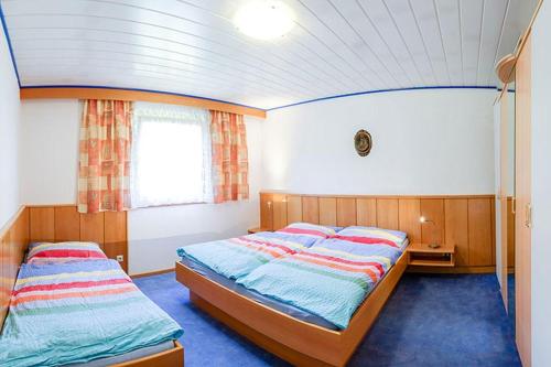 Postel nebo postele na pokoji v ubytování Bungalows Sonnenhang