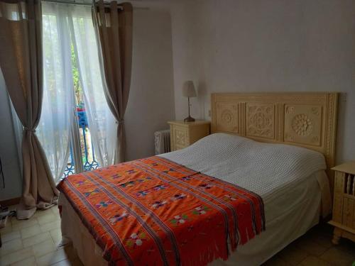 Ένα ή περισσότερα κρεβάτια σε δωμάτιο στο Argeles Maison de Caractere