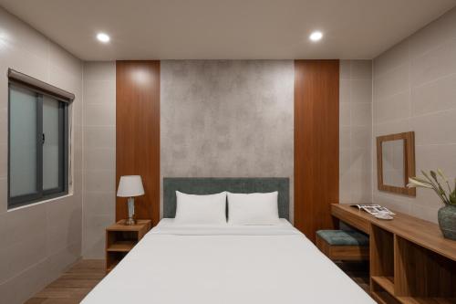 Katil atau katil-katil dalam bilik di Lumina Hotel Da Lat Central