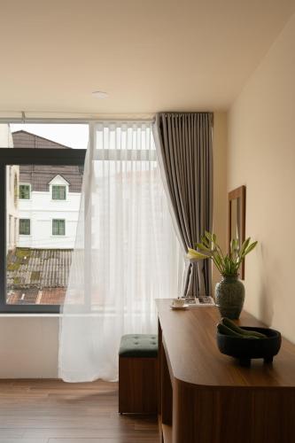 Katil atau katil-katil dalam bilik di Lumina Hotel Da Lat Central