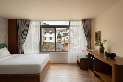 Voodi või voodid majutusasutuse Lumina Hotel Da Lat Central toas