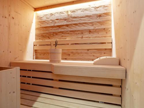 a sauna is shown with a wooden wall at Apart33 Top 1-22 in Haus im Ennstal