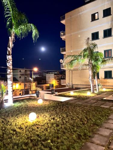 a view of a building at night at IG - "Villa Don Antonio" Apartments in Giardini Naxos