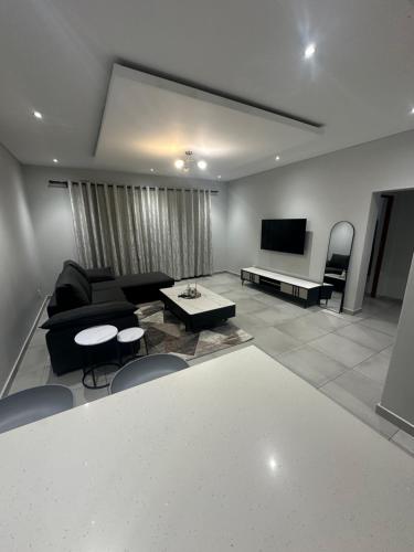 Телевизор и/или развлекательный центр в Mountain Drive Apartments