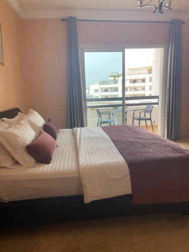 Ένα ή περισσότερα κρεβάτια σε δωμάτιο στο Superbe appartement marina agadir