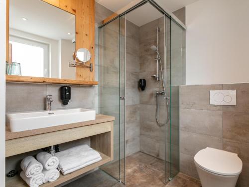 a bathroom with a sink and a shower at Apart33 Top 1-25 in Haus im Ennstal